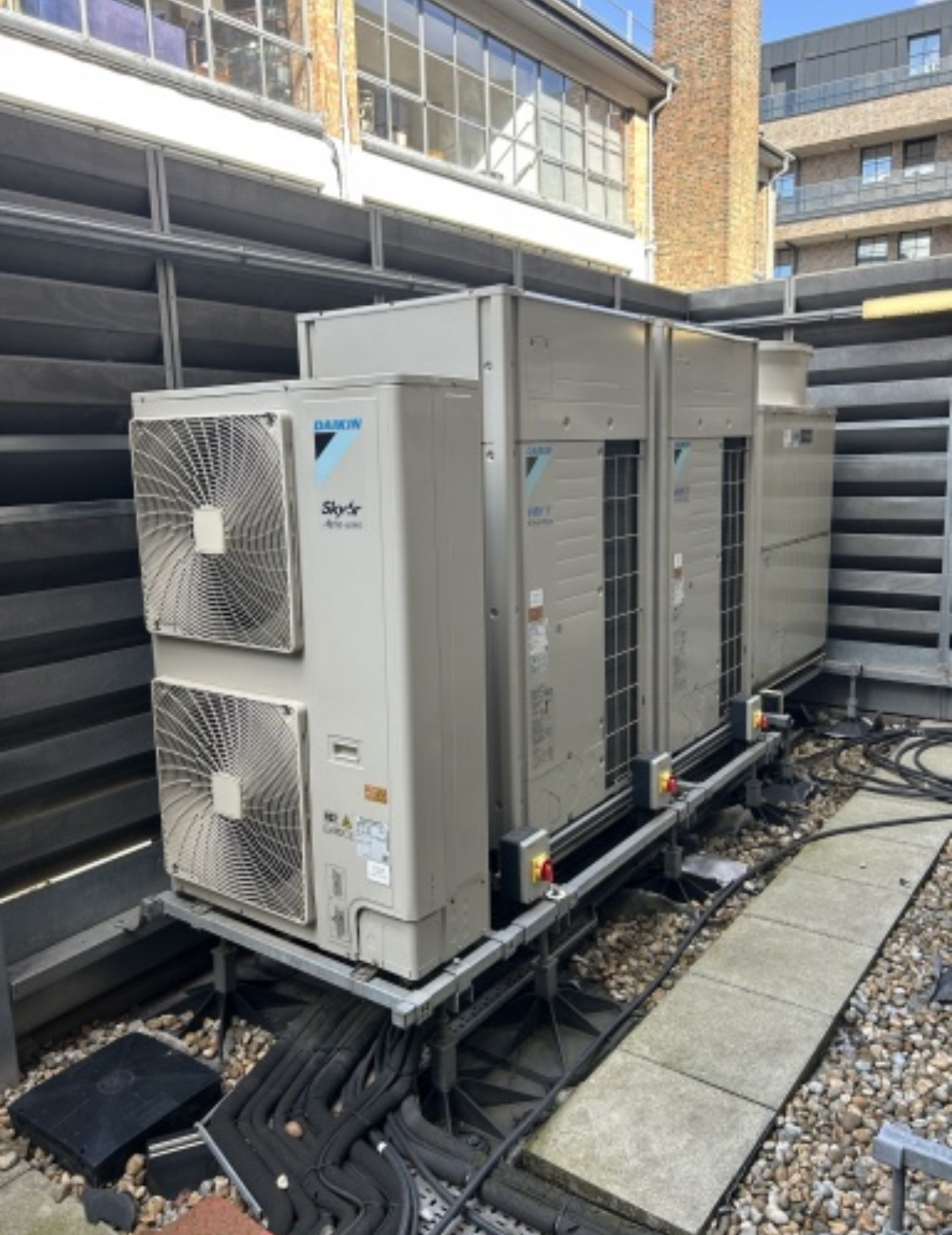 F-Gas certified air conditioning engineer in branded uniform